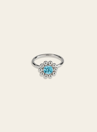 Daisy ring with a blue stone, silver