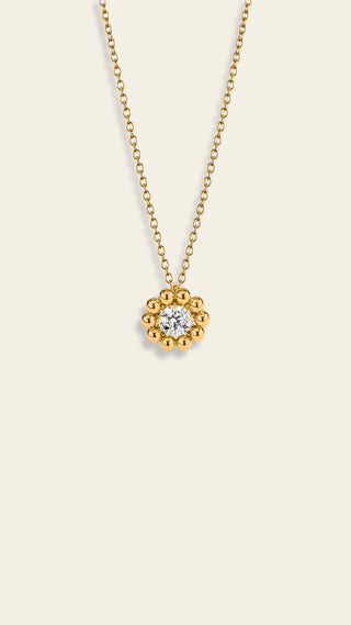 Daisy pendant with a clear stone, yellow gold-plated bronze