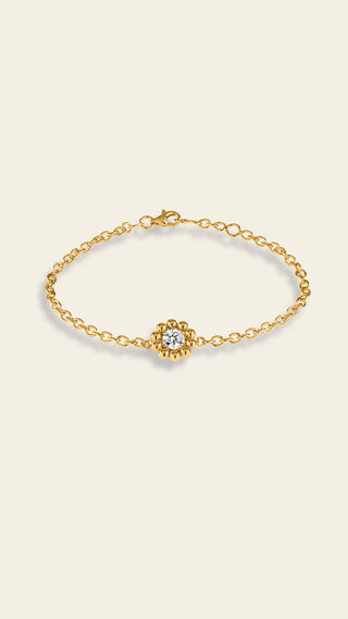 Daisy bracelet with a clear stone, yellow gold-plated bronze